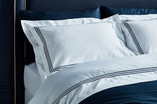 australian designed luxury organic cotton hotel collection quilt set in white with navy stitching